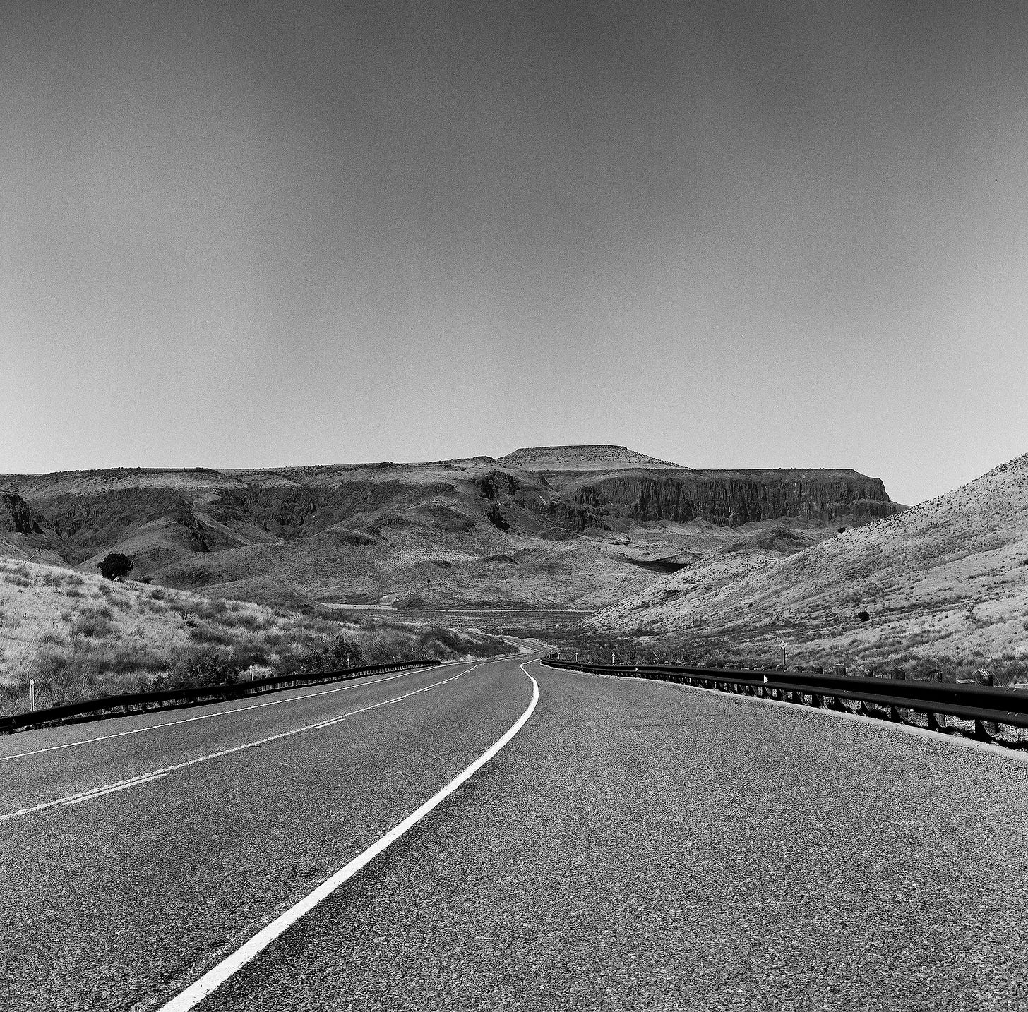 Long and winding road through mountains.