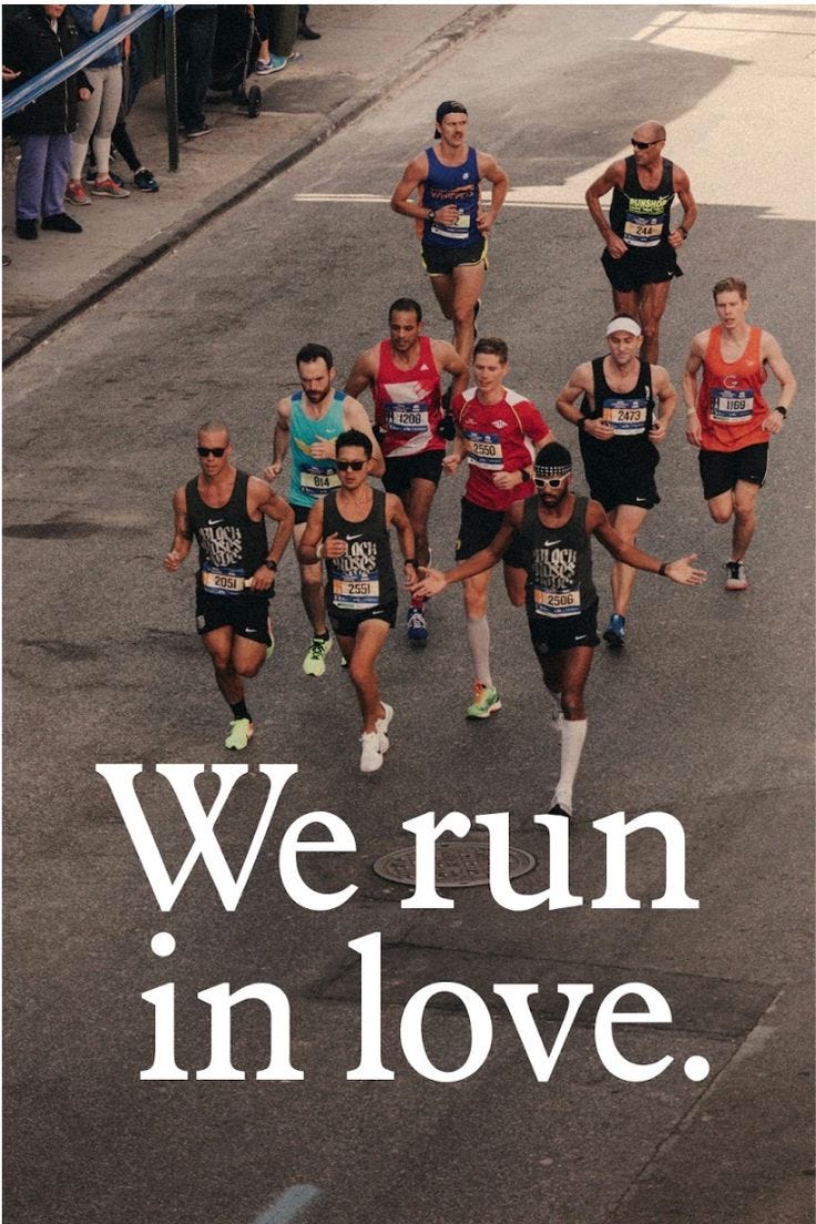 This may contain: a group of people running down a street with the words we run in love