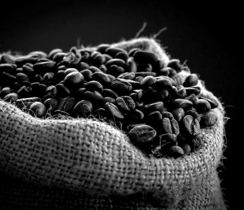 shallow focus photography of coffee beans in sack
