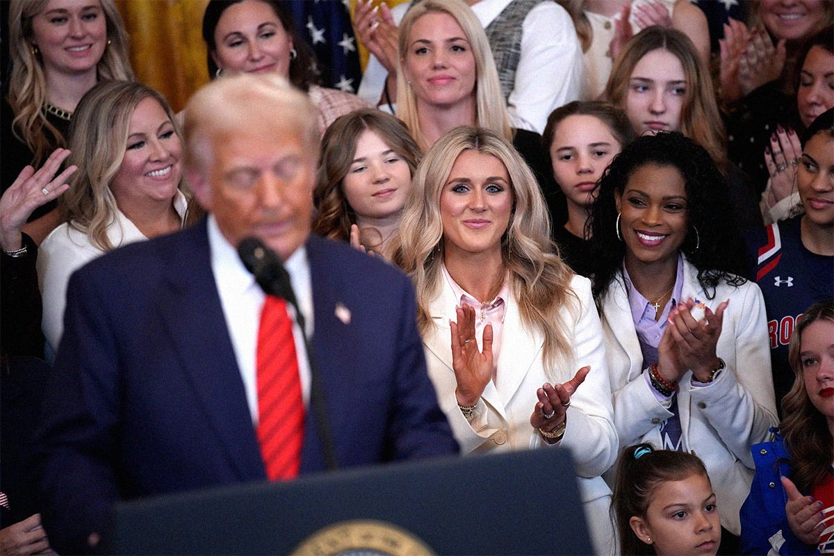 Political activist and former competitive swimmer Riley Gaines (C) watches as U.S. President Donald Trump delivers remarks before signing the “No Men in Women’s Sports” executive order in the East Room at the White House on February 5, 2025 in Washington, DC. Political activist and former competitive swimmer Riley Gaines (C) watches as U.S. President Donald Trump delivers remarks before signing the “No Men in Women’s Sports” executive order in the East Room at the White House on February 5, 2025 in Washington, DC.