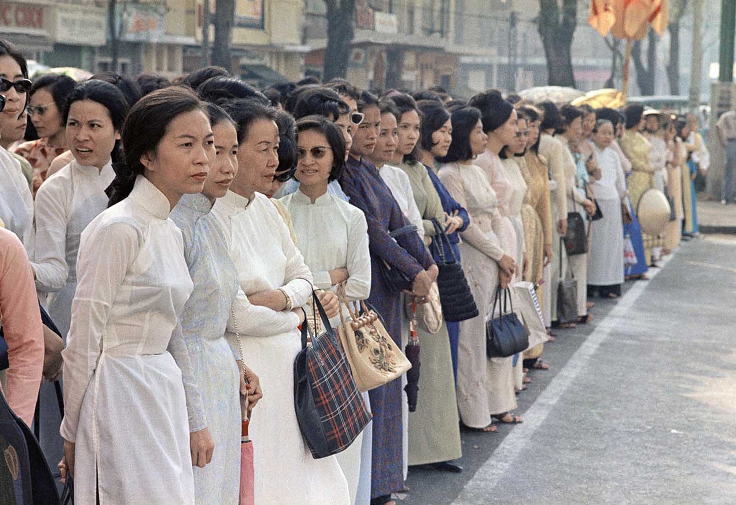 April 1968, Saigon: Vietnamese women navigate the city streets, a glimpse into everyday life during a period of intense conflict and urban unrest. April 1968, Saigon: Vietnamese women navigate the city streets, a glimpse into everyday life during a period of intense conflict and urban unrest.