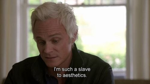 This may contain: a man with white hair is looking at something