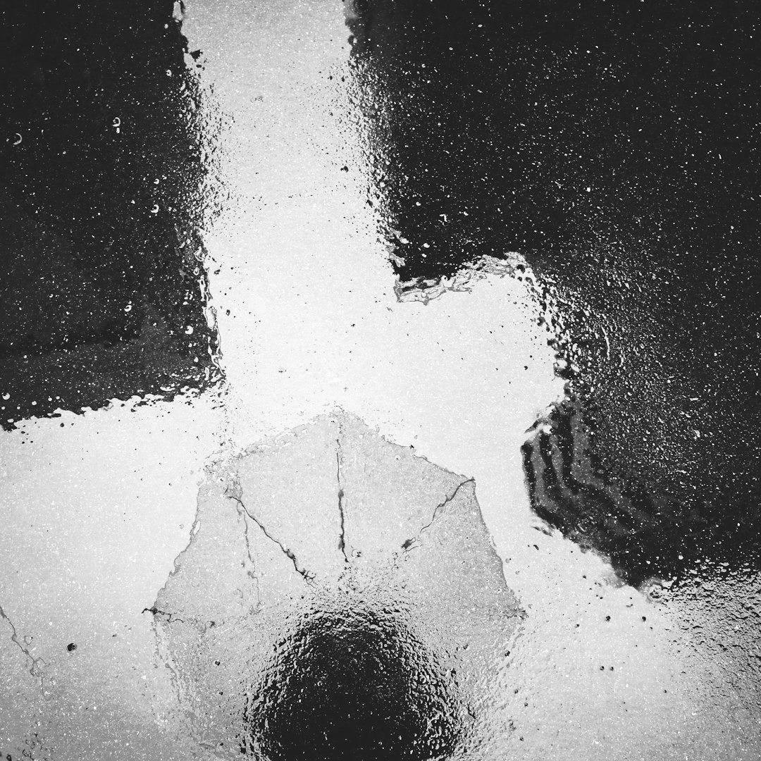 a person holding an umbrella in the rain a person holding an umbrella in the rain