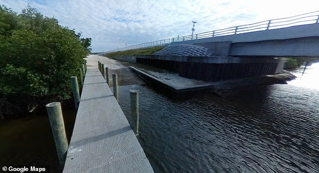 Little Mud Creek Boat Ramp beach access with posted signs at the dune crossover, sandy path and water beyond, about a mile north of Blind Creek’s nude-optional area. Little Mud Creek Boat Ramp beach access with posted signs at the dune crossover, sandy path and water beyond, about a mile north of Blind Creek’s nude-optional area.