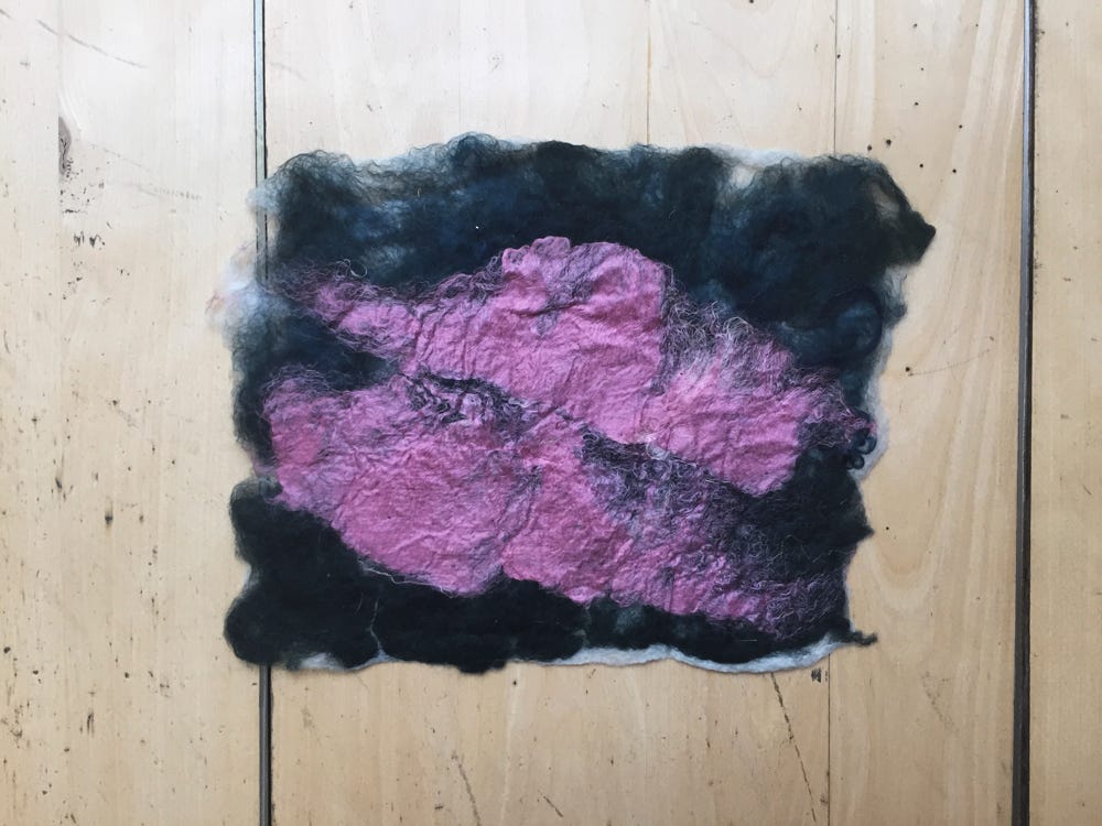 Foreground: pink silk Background: dark green + dark blue wool.