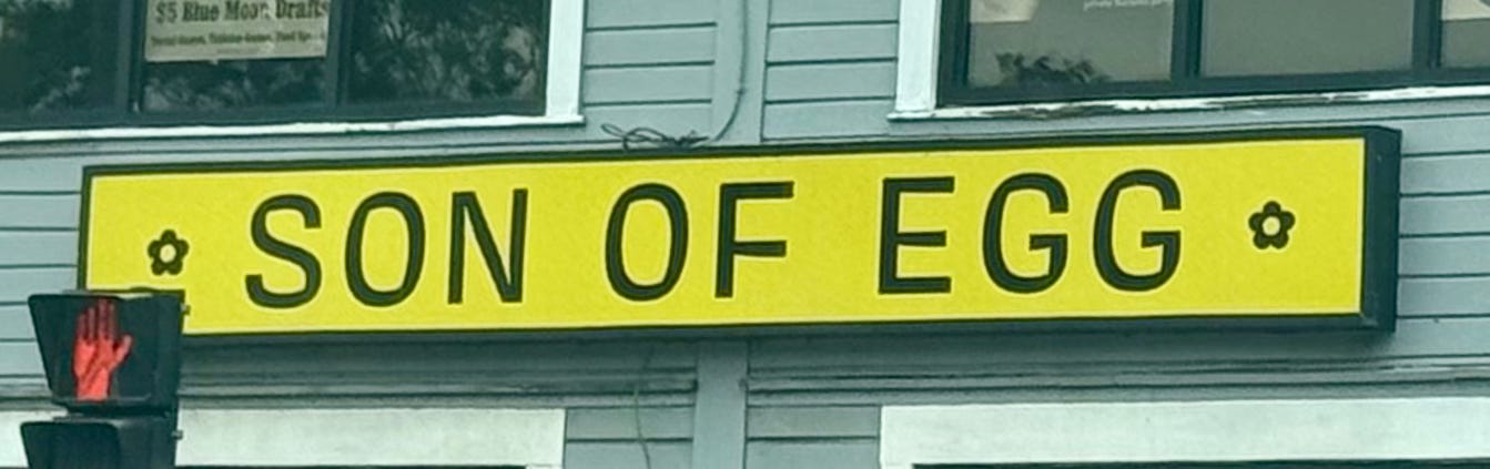 Yellow sign reading: "SON OF EGG"