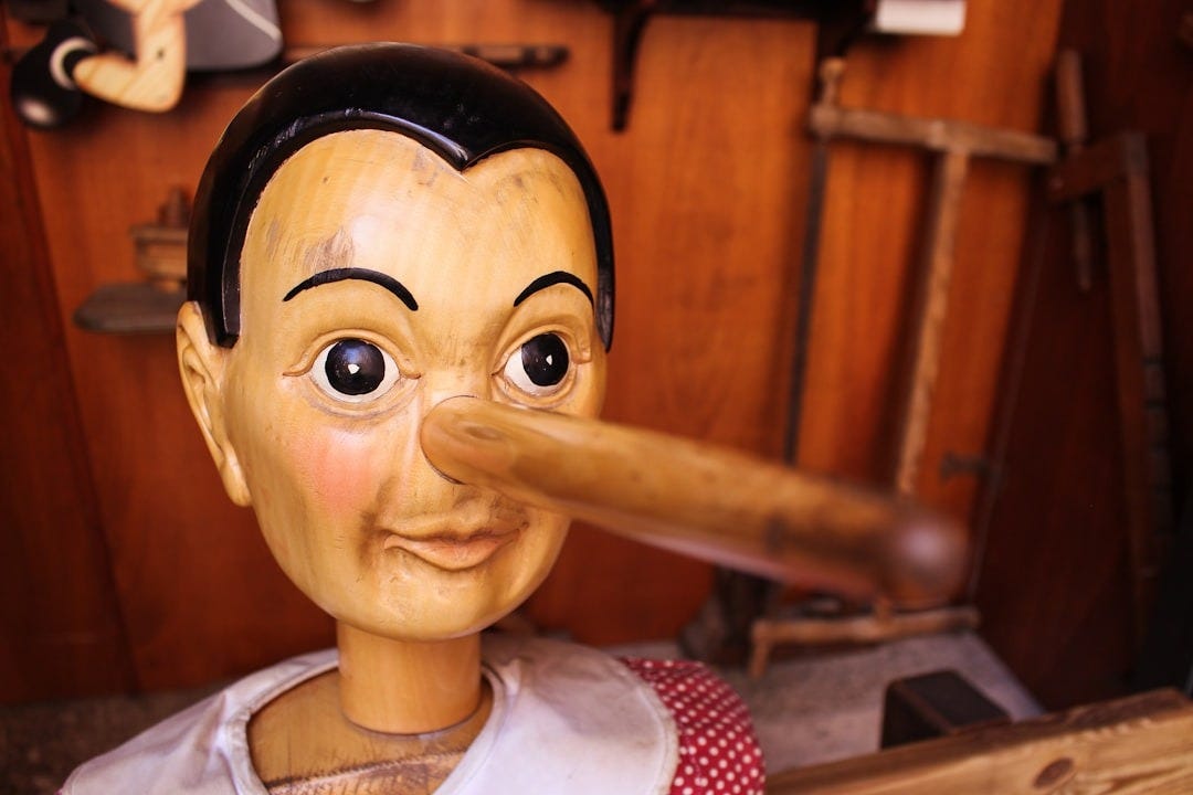 selective focus photography of Pinocchio puppet