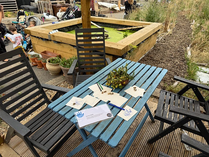Creative prompts scattered around the garden, alongside nature-inspired artwork