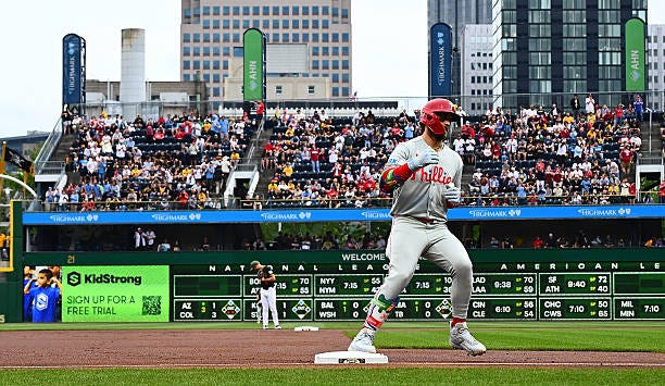 Bryce Harper of the Philadelphia Phillies rounds the bases after hitting a three run home run in the first inning during the game against the...