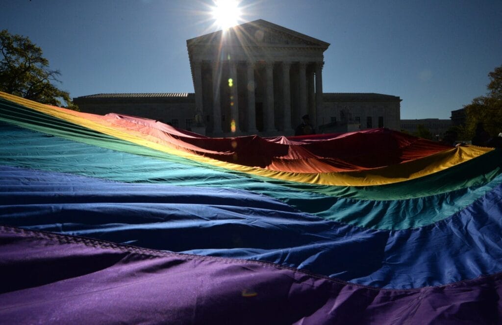 Pride Flag in front of the capitol building Pride Flag in front of the capitol building