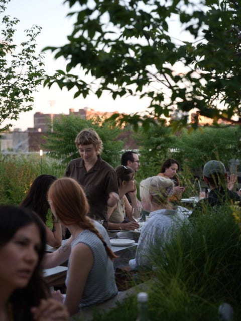 A green rooftop seating area. 