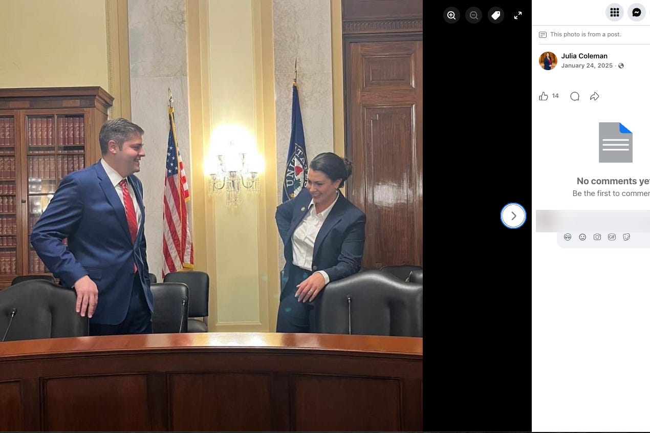 Julia and Jacob Coleman pose beside chairs and a curved table in a Senate setting. Julia and Jacob Coleman pose beside chairs and a curved table in a Senate setting.