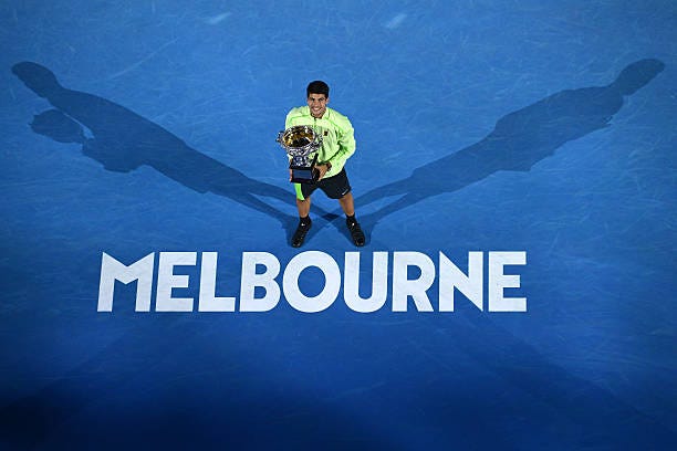 Carlos Alcaraz of Spain poses with the Norman Brookes Challenge Cup at the presentation ceremony after his victory in the Men's Singles Final against... Carlos Alcaraz of Spain poses with the Norman Brookes Challenge Cup at the presentation ceremony after his victory in the Men's Singles Final against...