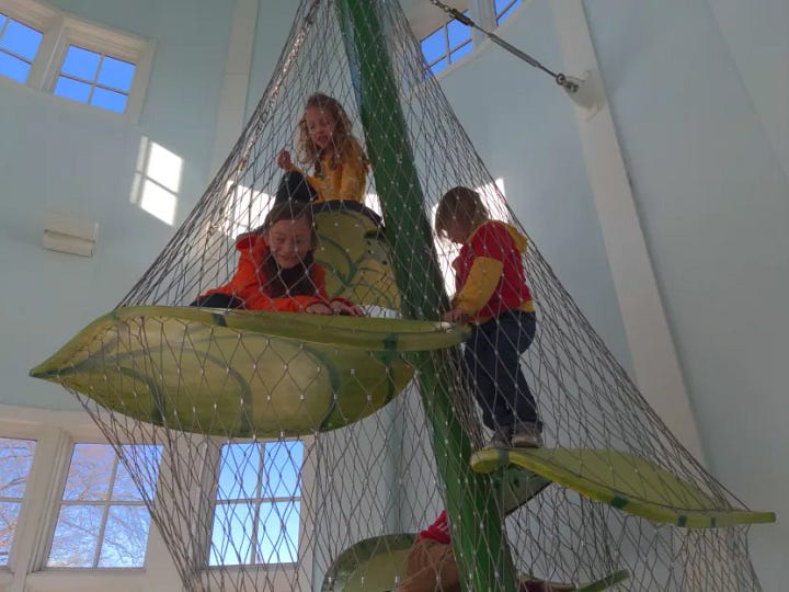 My kiddos climbing up a beanstalk, and my youngest dancing with a statue.