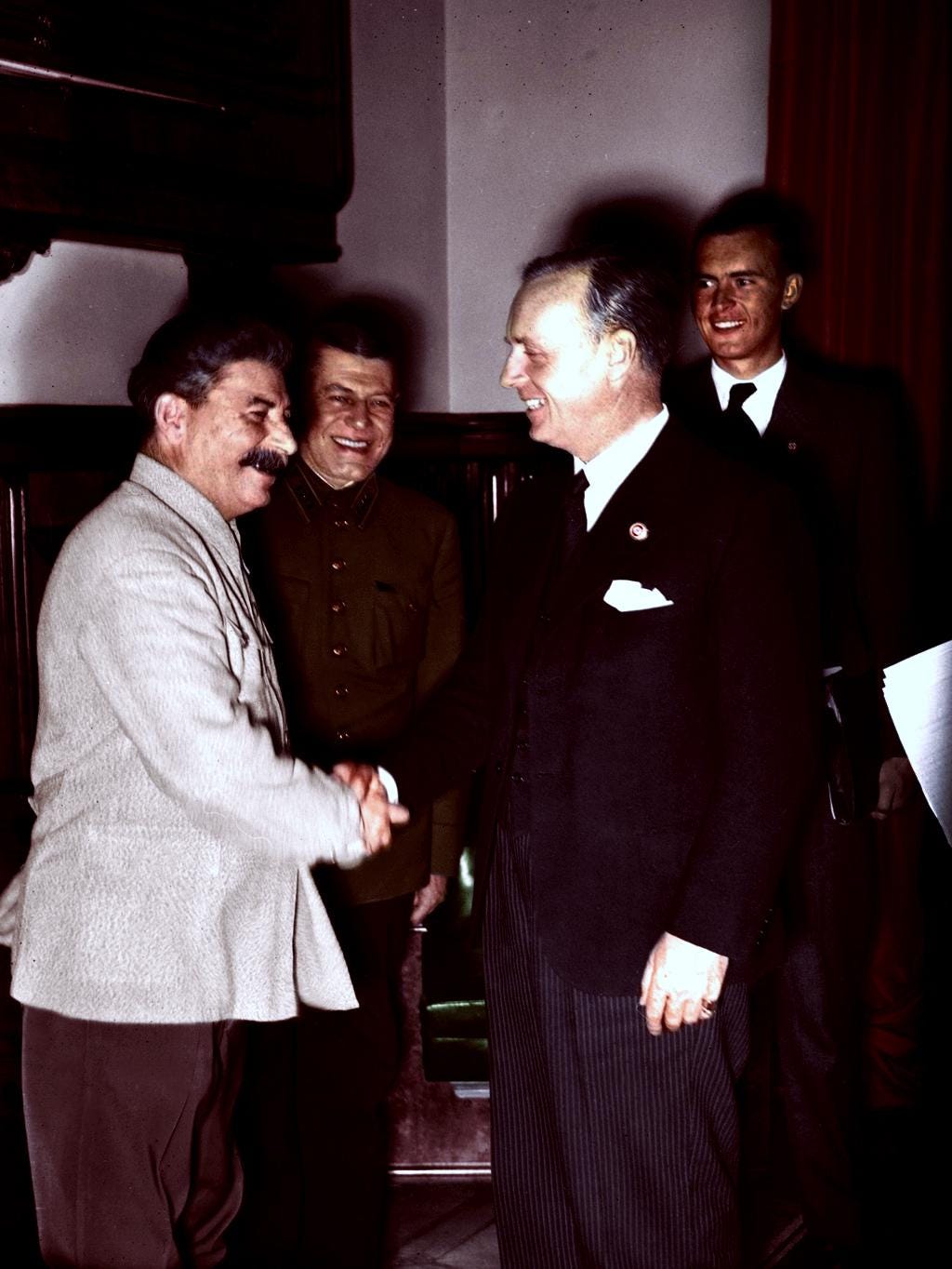 Nazi Foreign Minister Joachim von Ribbentrop shakes hands with Joseph Stalin after signing the Molotov-Ribbentrop Pact, 1939 (colorized). Nazi Foreign Minister Joachim von Ribbentrop shakes hands with Joseph Stalin after signing the Molotov-Ribbentrop Pact, 1939 (colorized).