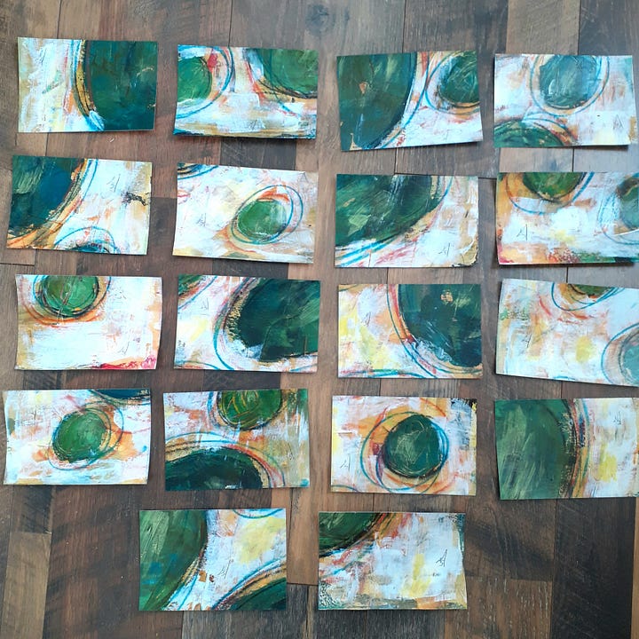 Mixed media art of distressed orbs on white background cut into postcards