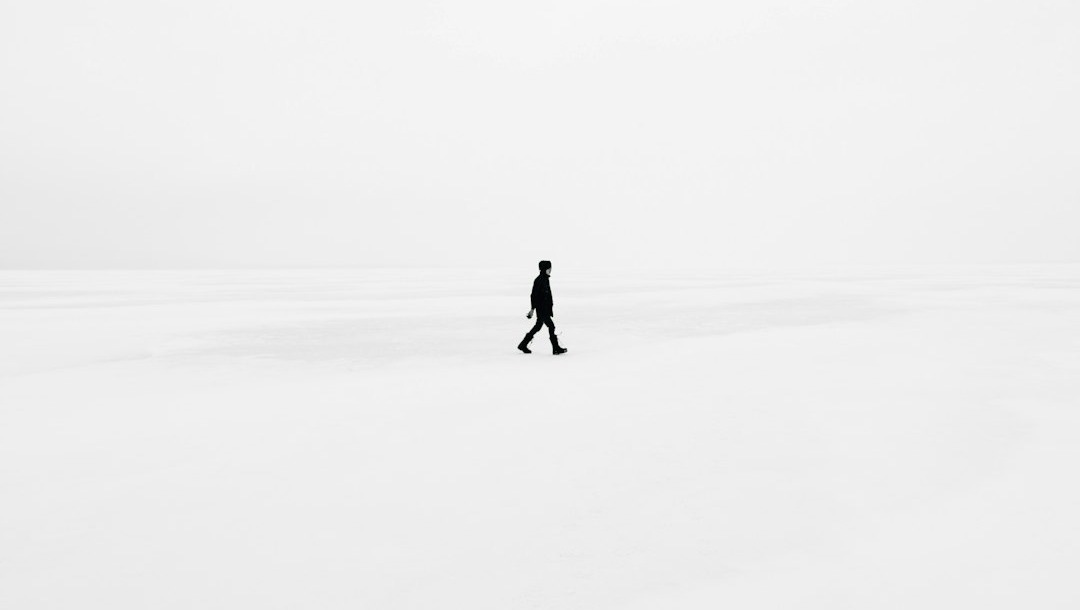person walking on snowfield