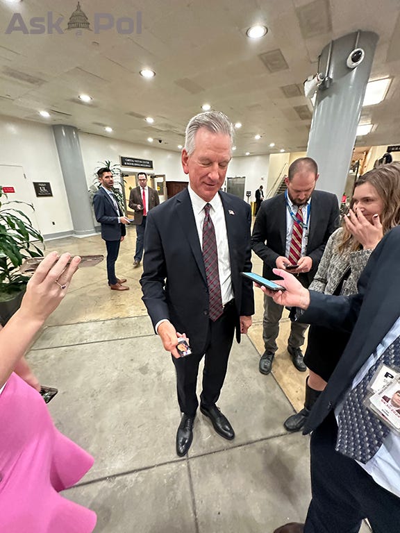 A politician offers Trump mints to press corps as a female reporter giggles in basement of US Capitol A politician offers Trump mints to press corps as a female reporter giggles in basement of US Capitol