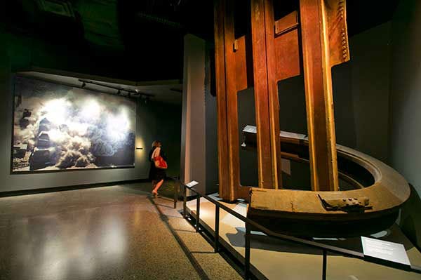A two-inch thick World Trade Center steel column, that was bent into a horseshoe shape, and facade segment, are displayed at the National Sept. 11 Memorial Museum. (AP Photo)