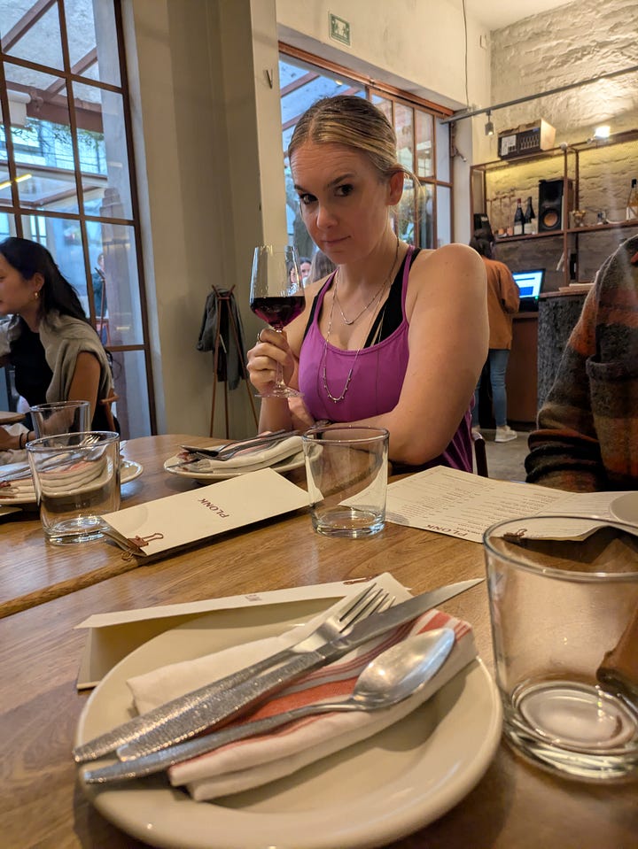 Me, enjoying a glass of wine before dinner and the kitchen-bar counter at Plonk