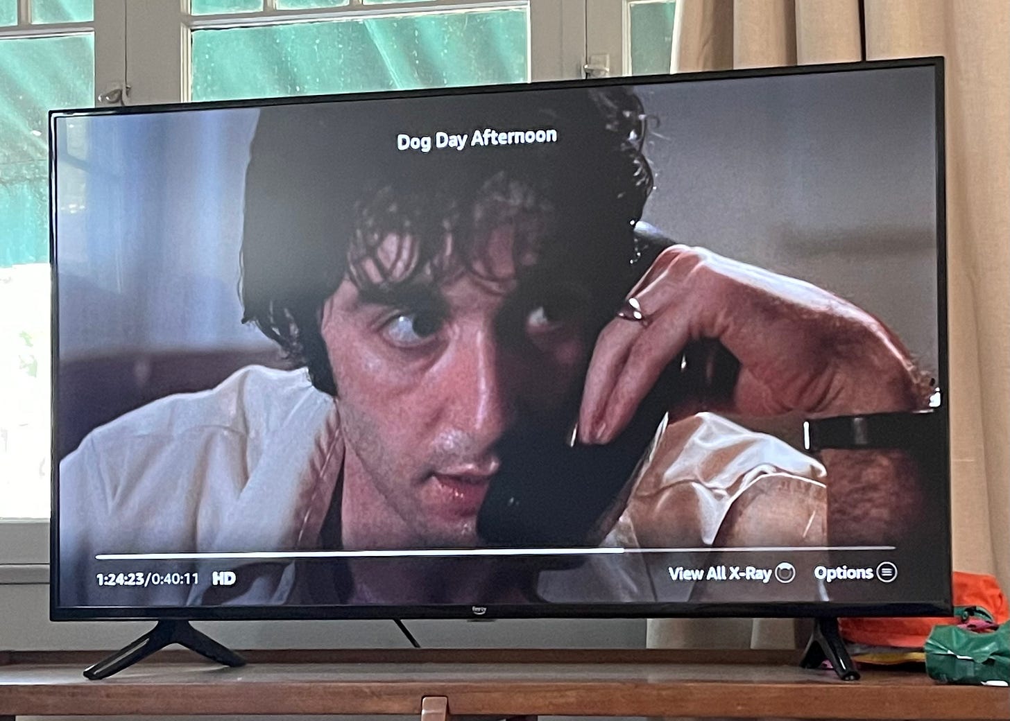 A photo of a TV with the paused movie Dog Day Afternoon on it.