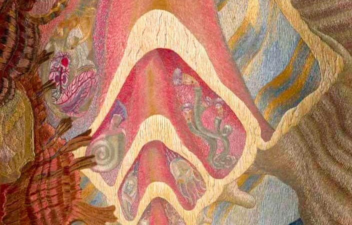 Abstract embroidery of shell-like formation in pink, green, and gold hues