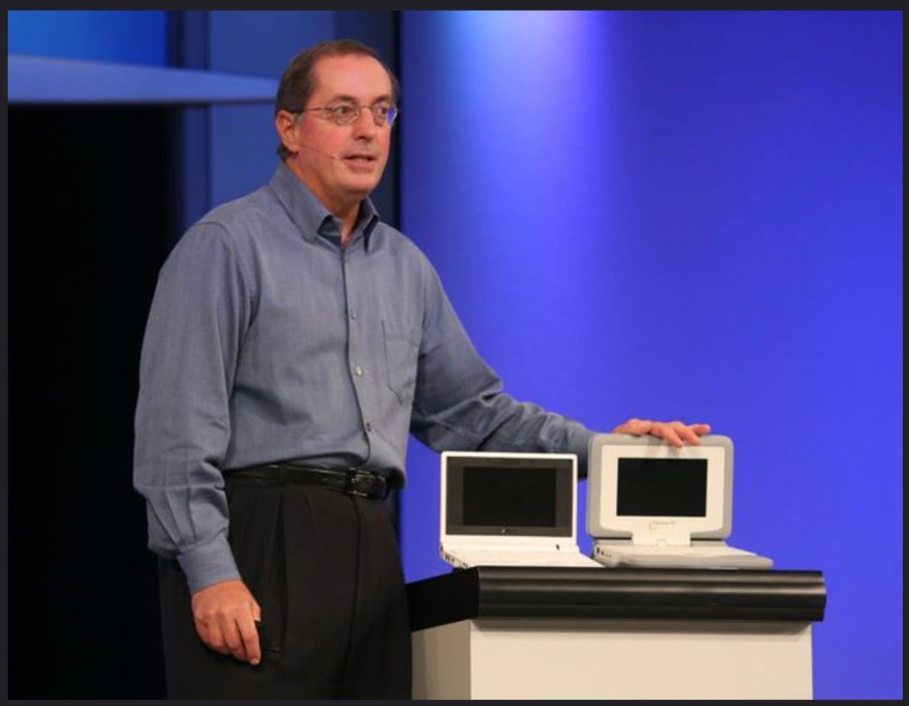 On stage at Intel IDF is CEO with a stand showing off two devices. On stage at Intel IDF is CEO with a stand showing off two devices.