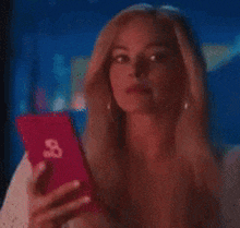 Meme from Margot Robbie in Barbie looking at her phone to giving a Letterboxd rating.