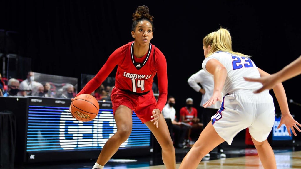 Louisville Cardinals guard Kianna Smith dribbles the basketball against the DePaul Blue Demons