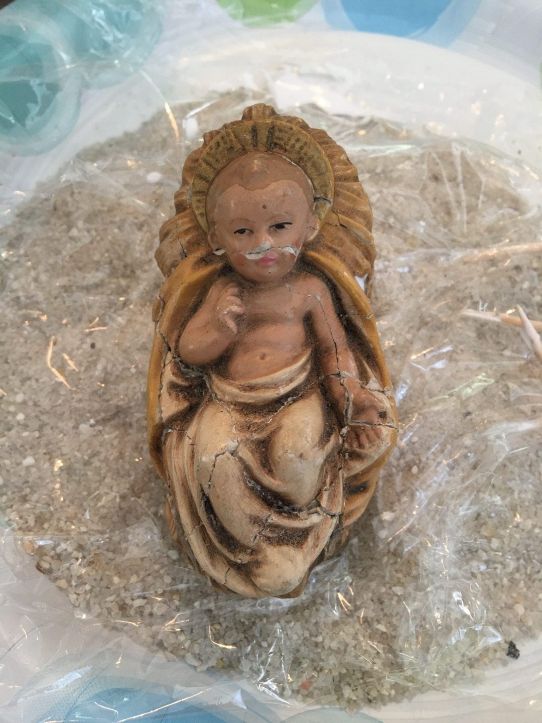 glued Jesus figurine glued together