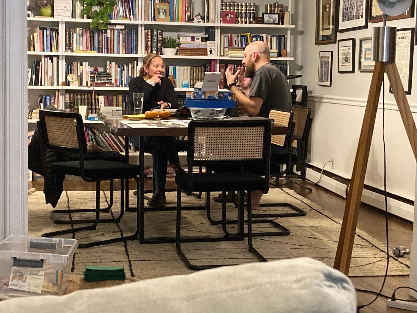 photo of Erin and Henry sitting at a table as Erin interviews him photo of Erin and Henry sitting at a table as Erin interviews him