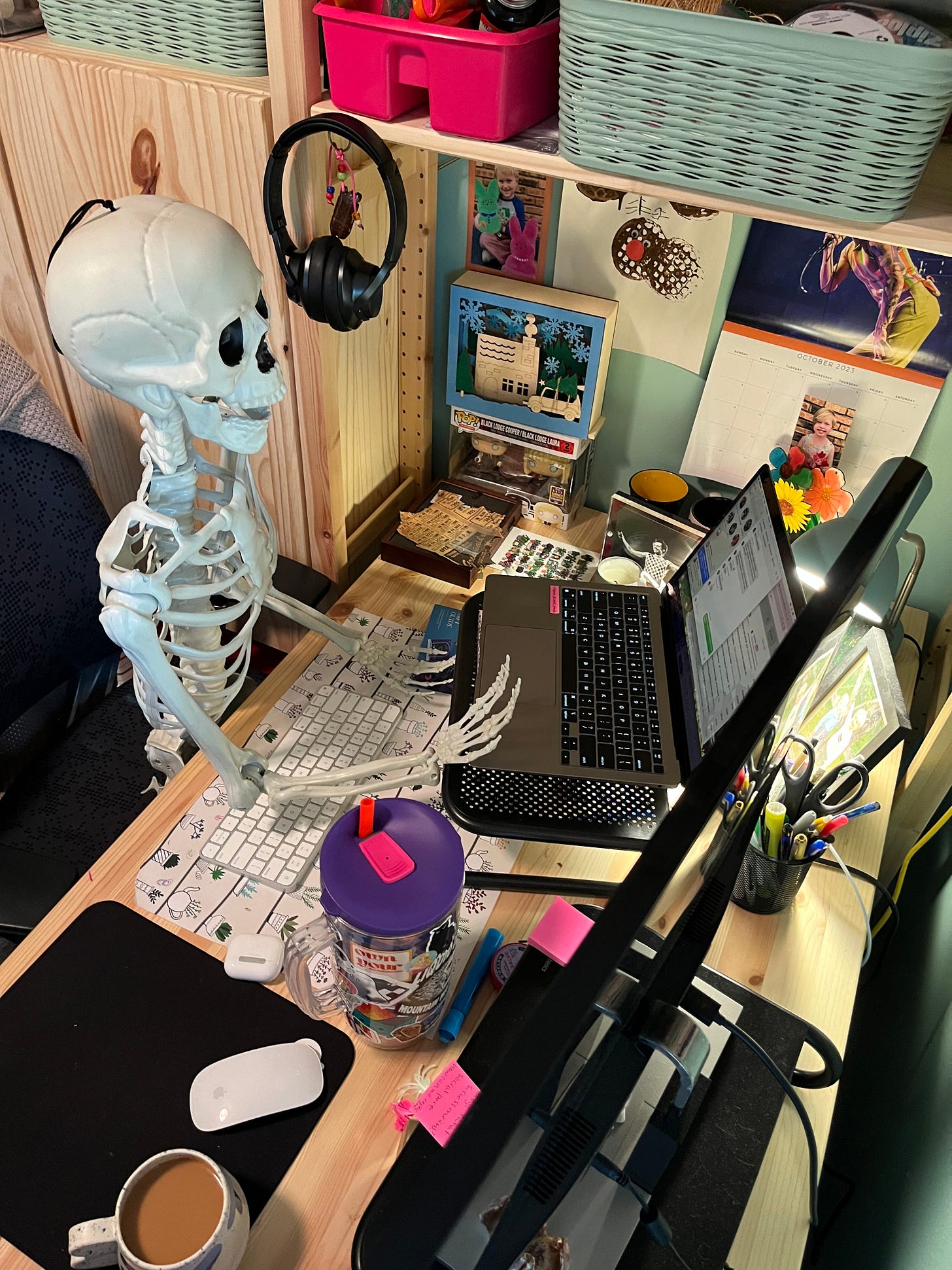 skeleton working at a desk