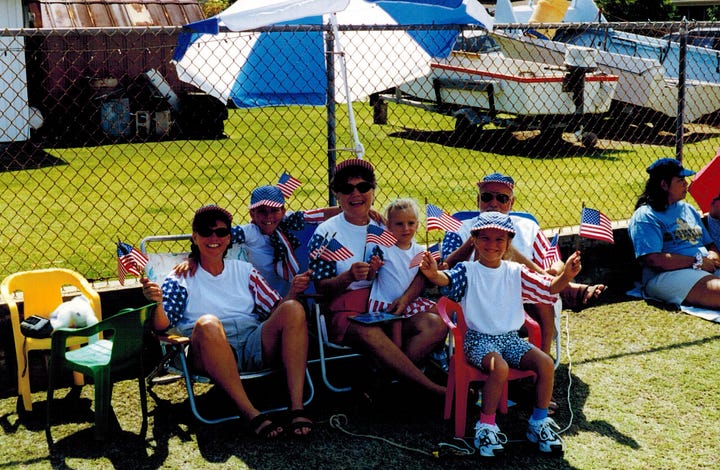 On the left, a family photo of Melora Fern with kids and her parents, all dressed in stars and stripes clothes. On the right a shaggy black and white dogs sits in front of thousands of flags in a yard with white tents in the background all dressed in