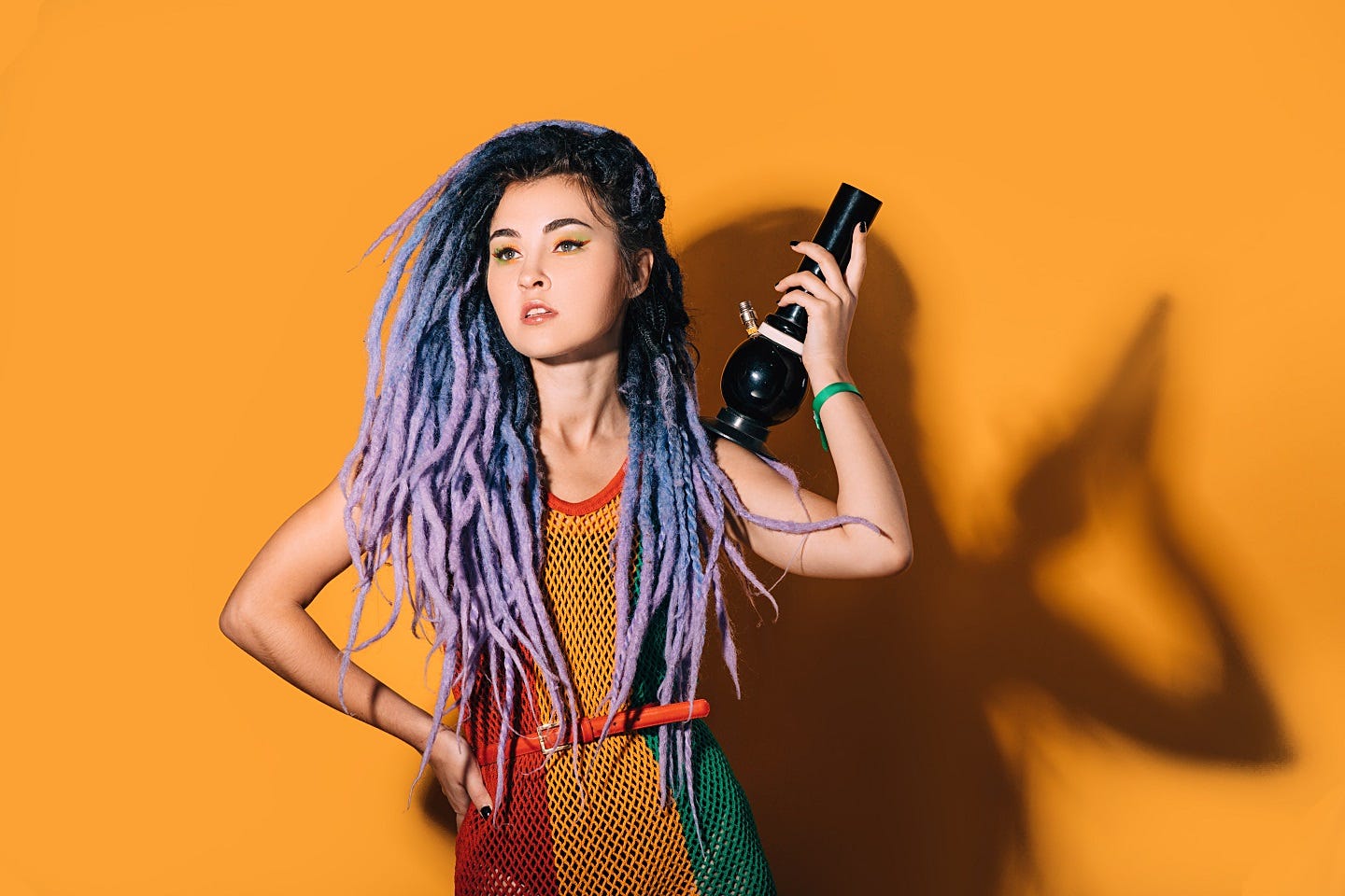 Woman holding a bong