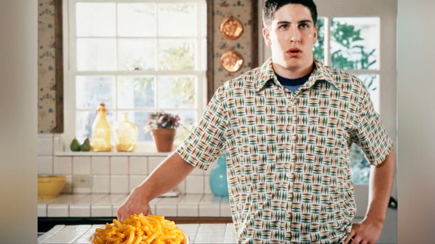 Jason Biggs in American Pie with his fingers in a bowl of mac & cheese