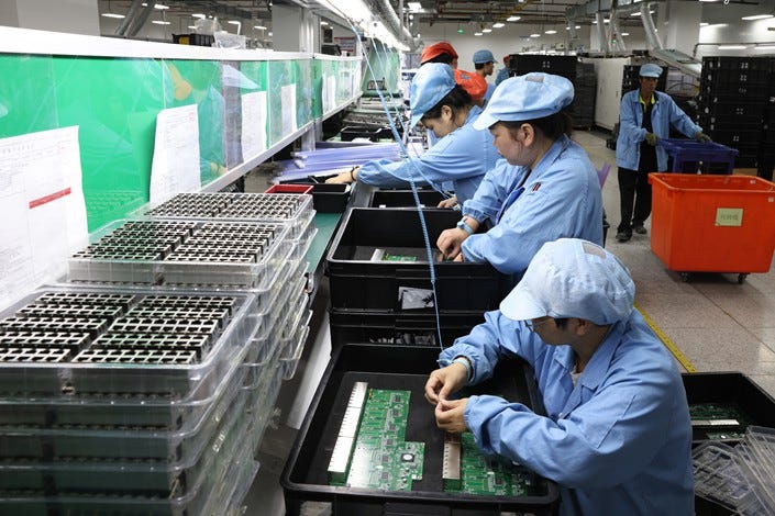Workers produce electronics for a tech company in Fuzhou, East China’s Fujian province, on Wednesday. Photo: VCG