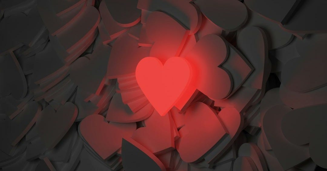 a red heart surrounded by black hearts