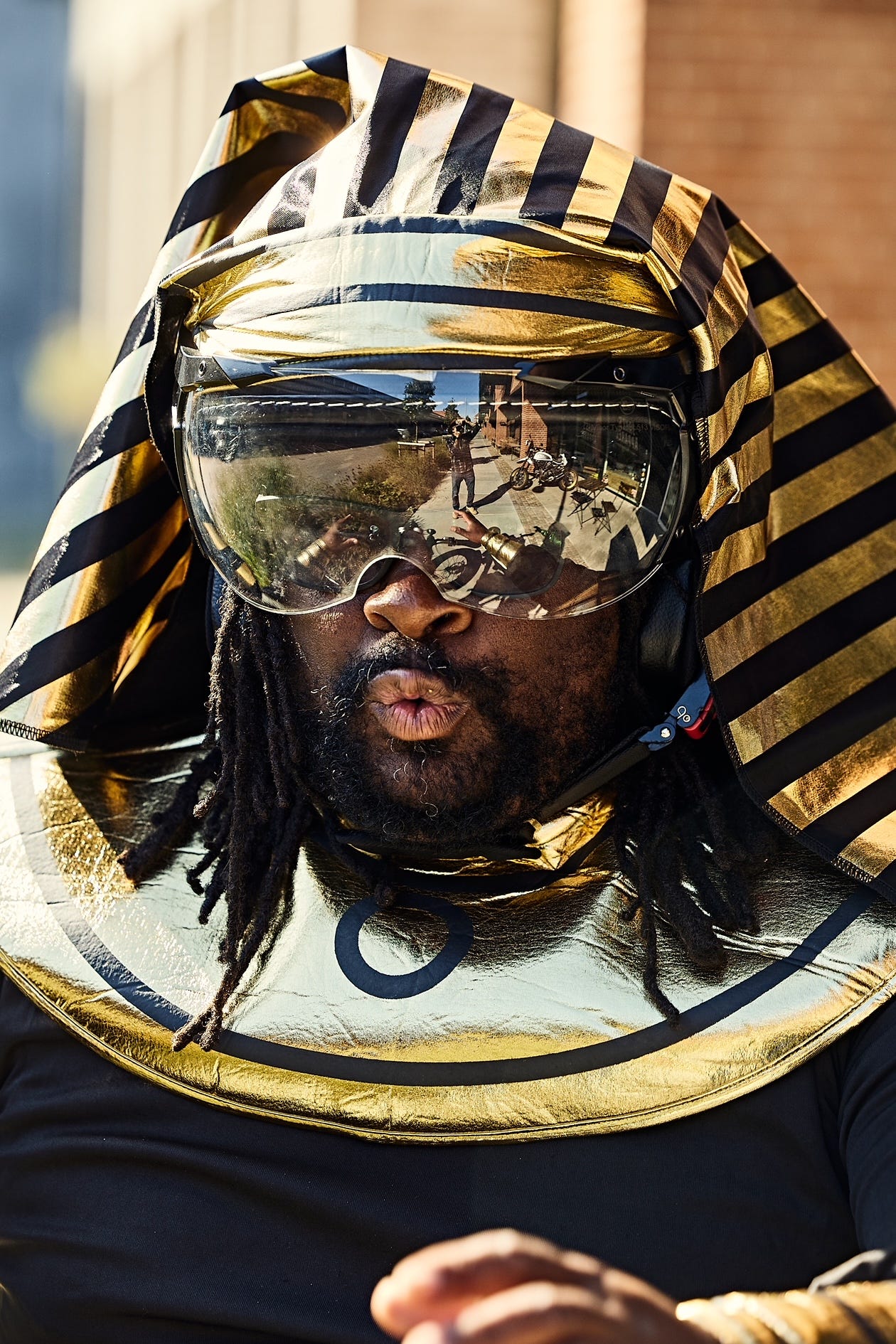 A digital composite image acting as a directory for FatbikeHero, featuring image of FatbikeHero Egyptian  Costume.