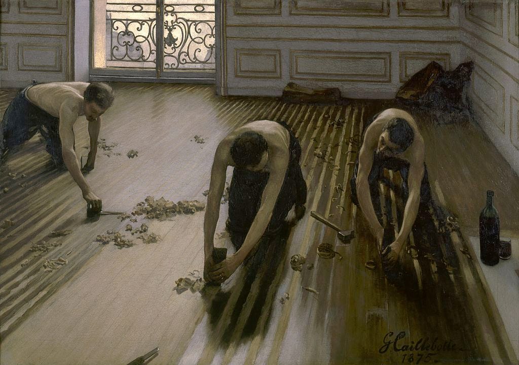 pintura a óleo. descrição da wikimedia: Na cena, o observador fica acima de três operárias de joelhos, raspando um chão de madeira em um apartamento burguês—agora considerado o estúdio do próprio Caillebotte, na rue de Miromesnil, 77, no 8o arrondissement de Paris.[3] Uma janela na parede traseira admite luz natural. As operárias são todas mostradas com torsos nus e cabeças inclinadas, sugerindo uma conversa.[4] O interesse de Caillebotte pelo nu masculino, ambientado em um contexto moderno, tem sido ligado à sua suposta homossexualidade, no entanto, fazia parte de uma tendência maior, não necessariamente limitada a artistas homossexuais, que foi introduzida pela primeira vez por Courbet em uma pintura de dois lutadores.