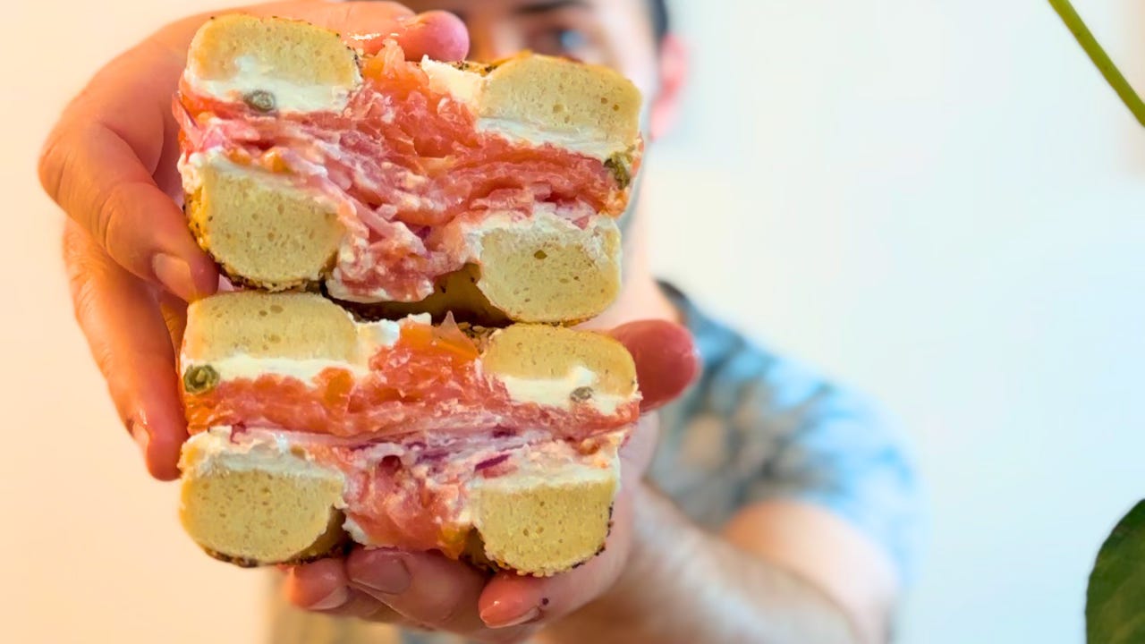 An everything bagel with cream cheese and lox