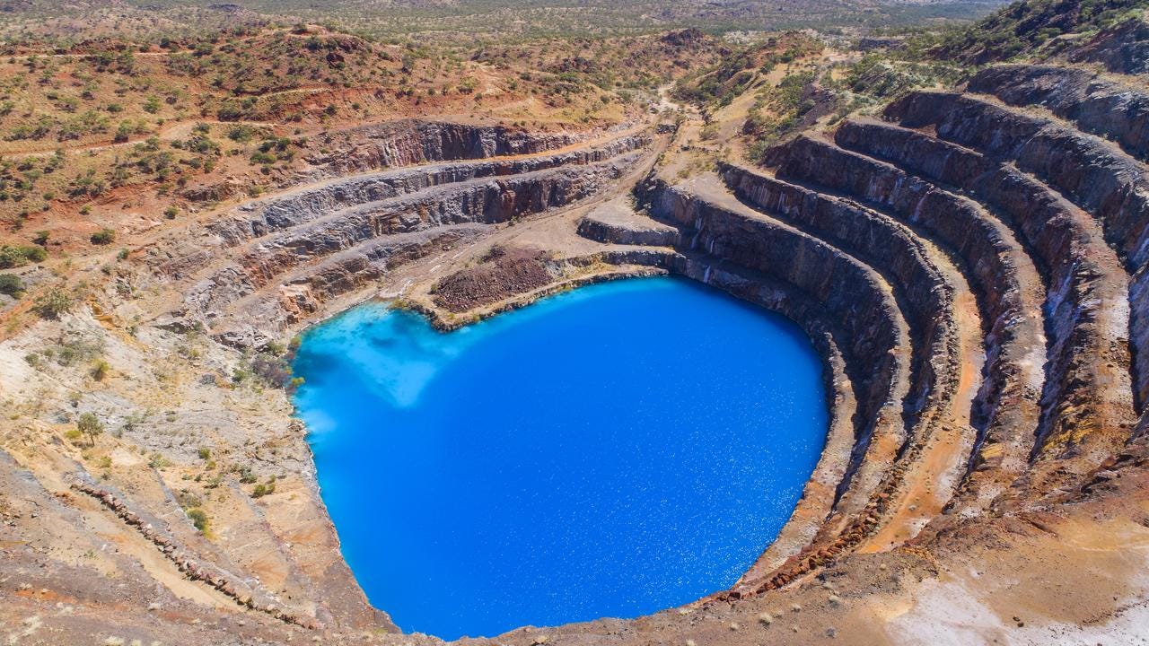 The abandoned Mary Kathleen Uranium mine west of Cloncurry in Queensland, has become an instagram sensation and outback tourism attraction due to its curious electric blue colour. Photo Lachie Millard The abandoned Mary Kathleen Uranium mine west of Cloncurry in Queensland, has become an instagram sensation and outback tourism attraction due to its curious electric blue colour. Photo Lachie Millard