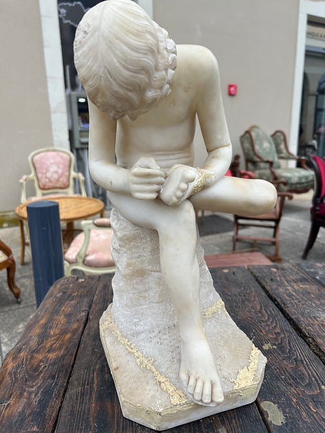 Three photos from an outdoor brocante antiques market on the grounds of a historic château in Durtal, France, with tables of vintage goods.