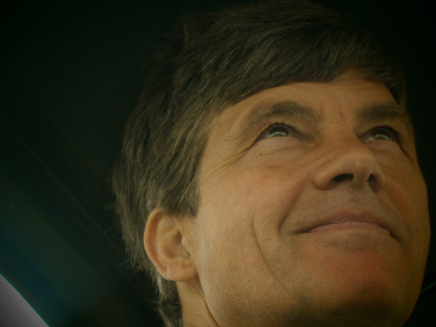 Pel Stockwell handsome man looking towards the horizon with a comfortable smile on his face