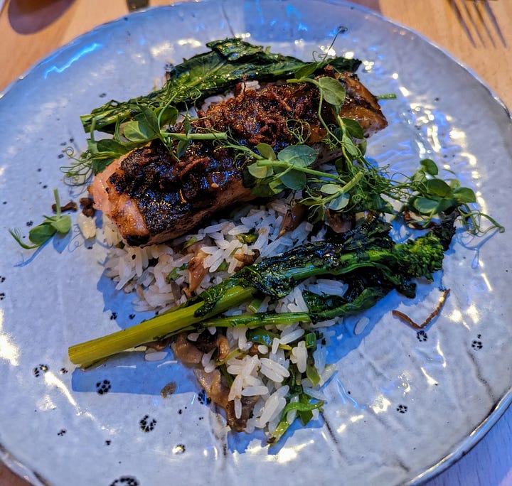 Left to right: Shoyu salmon (salmon on top of rice and covered with herbs and broccolini); Hanger steak (hanger steak accompanied by potatoes, broccolini, topped with hazelnuts and salsa verde)
