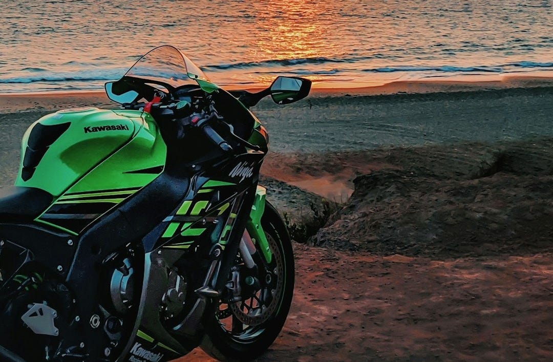 green and black Kawasaki Ninja seaside green and black Kawasaki Ninja seaside