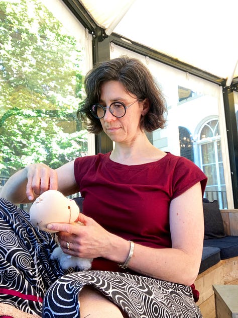 Natural fibre doll-maker Ildiko from Ildila Natural Handmade Dolls teaching a workshop, student Hannah Sanguinetti stitching a doll head, finished doll at the European Waldorf Doll Retreat 2025