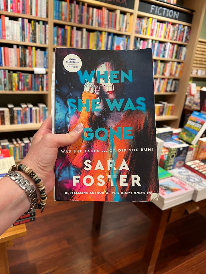 Sara Foster and Joanna Morrison are on a small stage, holding up Sara Foster's new thriller, 'When She Was Gone'. In other pictures, Sara is signing copies of her book, a hand is holding up a copy for the camera, and an audience is watching the event.