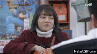 Deok-sun asks Taek if he wants a chip as she stuffs her face. She holds one out to him. Sleepy-looking, he turns to her and opens his mouth. Deok-sun puts the chip on his lower lip but then takes it back and eats it, cackling with glee. Taek slowly closes his mouth with a tired, dopey, resigned look.