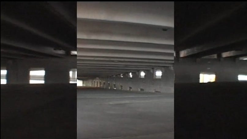 three separate shots tracking through an empty parking garage play side by side