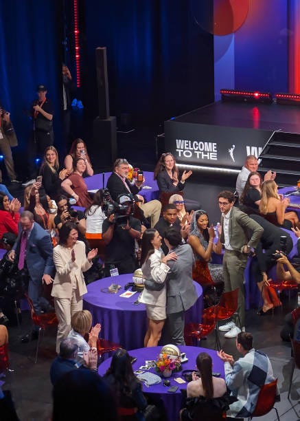In this image created on Pixel, Caitlin Clark attends the annual WNBA Draft, celebrating a historic incoming class of college players entering the...